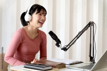 young woman is broadcasting with a microphone expressing herself