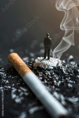 miniature man peeing on the ashes of a cigarette
