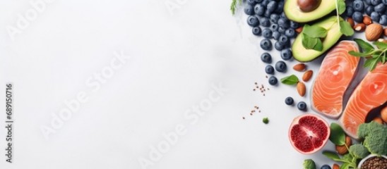 Choosing nutritious food Clean eating idea Cook with fish superfoods veggies artichokes Brussels sprouts fruits legumes and blueberries Overhead view for panoramic banner Copy space image Place