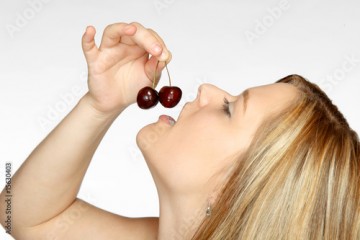 Young lady with cherries