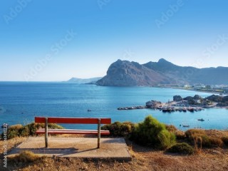 bench on a hill with sea ​​view