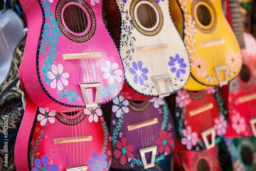 Background of colorful mexican guitars