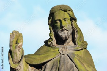 Historic Jesus on the mystery old Prague Cemetery, Czech Republic