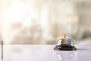 Service bell on hotel reception with Hotel background