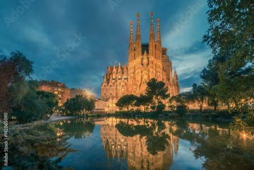 Barcelona, Catalonia, Spain: Basicila and Expiatory Church of the Holy Family, known as Sagrada Familia at sunset 
