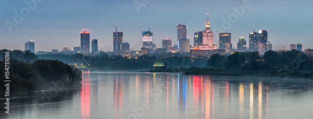 Night panorama of Warsaw skyline, Poland, over Vistula river in the night