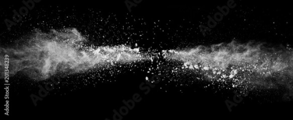 Abstract white powder explosion isolated on black background.