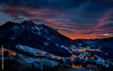 mountain village at sunset with clouds
