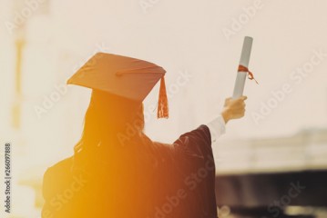 The back of the graduates wear cap at university.