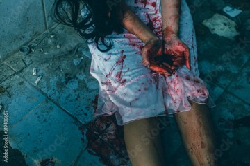 horror scence of women hands show red blood in her hands. Ghost women wear white dress stain blood at abandoned house