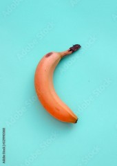 Red banana on blue background