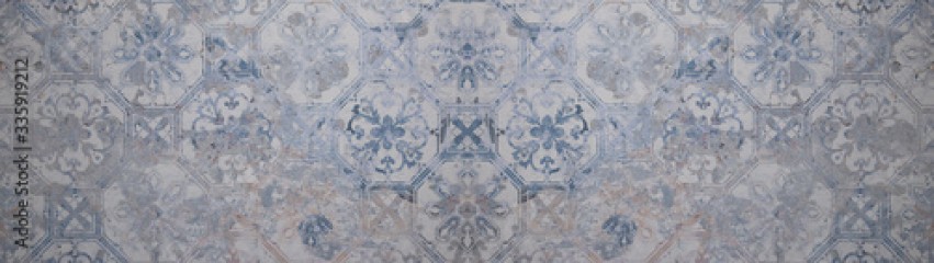 Old gray blue vintage shabby patchwork motif tiles stone concrete cement wall texture background banner 