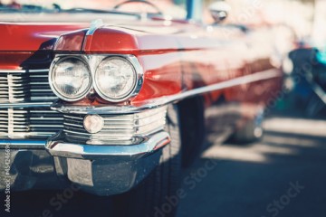 Classic car show, close-up on vehicle headlights, vintage color