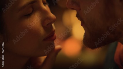 Closeup sexy lovers face enjoy love by fire. Sensual couple flirt on date