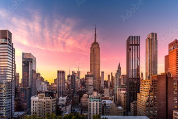 New York, USA - April 23, 2022: New York skyline at the end of sunset with Empire State Building in foreground