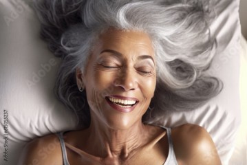 Generative AI illustration of a close-up portrait of a smiling middle-aged black woman with silver hair having an orgasm lying on the bed having a great time enjoying her sexuality.