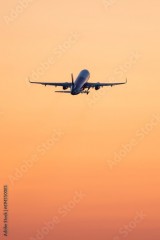 Plane takeoff at sunset.