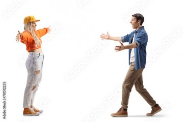 Full length profile shot of a young man and woman meeting and greeting each other