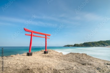 Red torii gate by the sea, Shimoda beach, Shizuoka Prefecture, Japan