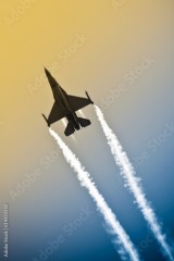 military jet aerobatics into an abstract gradient sky