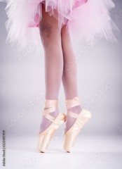 In selective focus of the lady legs with ballet shoes, standing with toes,for ballet basic pattern