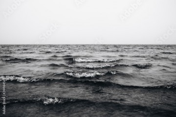 waves in the sea black and white photo