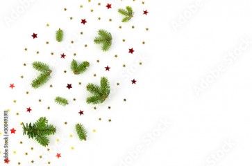 Christmas tree branches and stars confetti top view Frame on white background. Flat lay with copy space