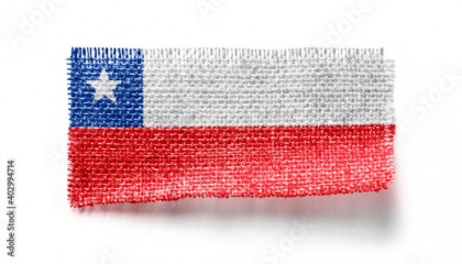 Chile flag on a piece of cloth on a white background