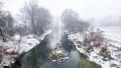 River in winter fog 