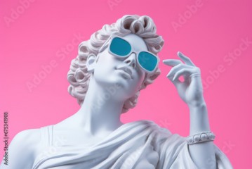 Portrait of a white sculpture of Aphrodite wearing blue glasses sitting in a haughty pose on a pink background.