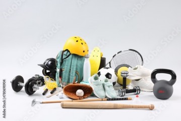 Many different sports equipment on light grey background